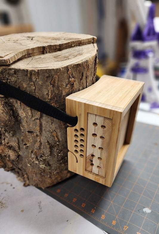 Minimalist solitary bee house made of bamboo - tree satchel-style